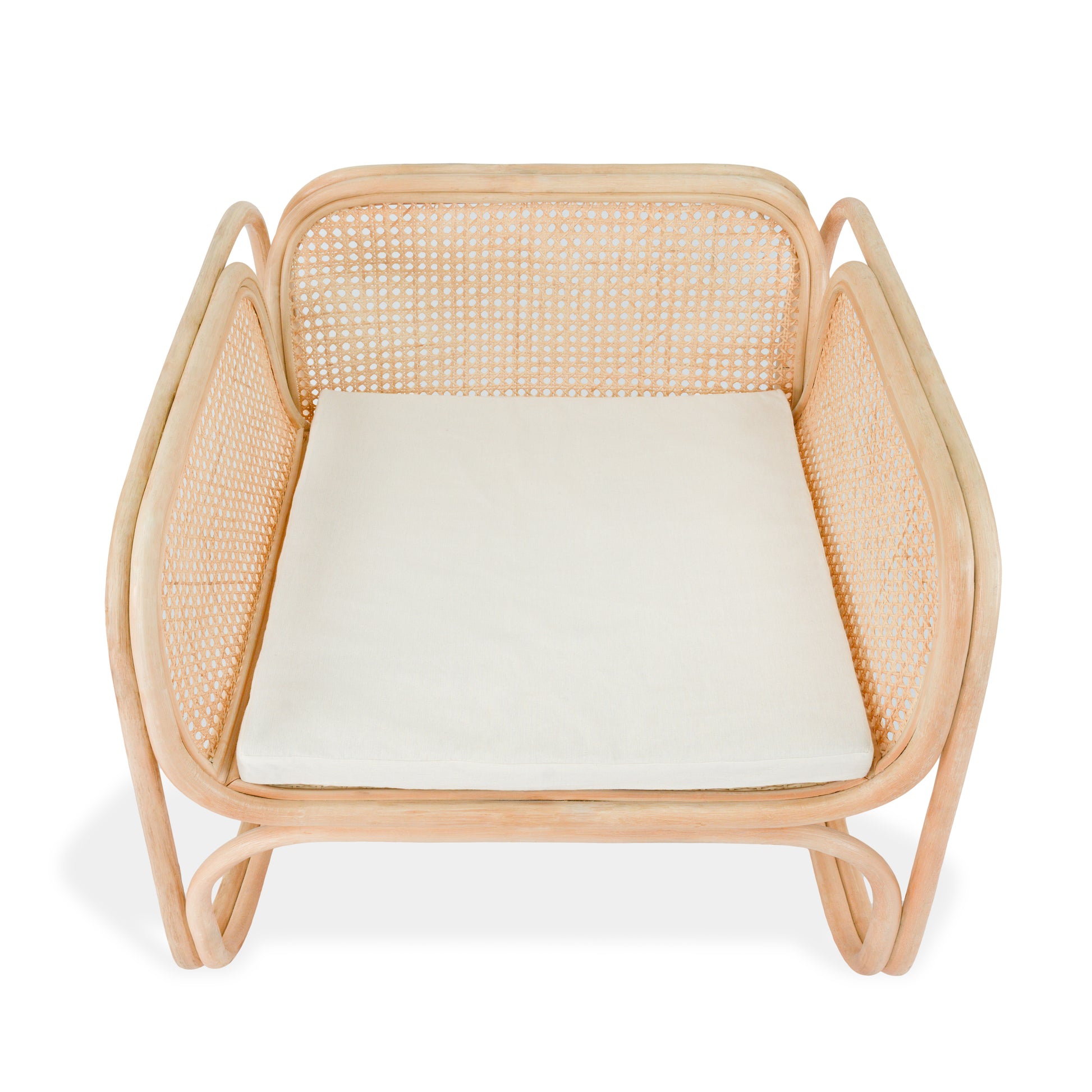 Rattan chair with a white cushion on a white background