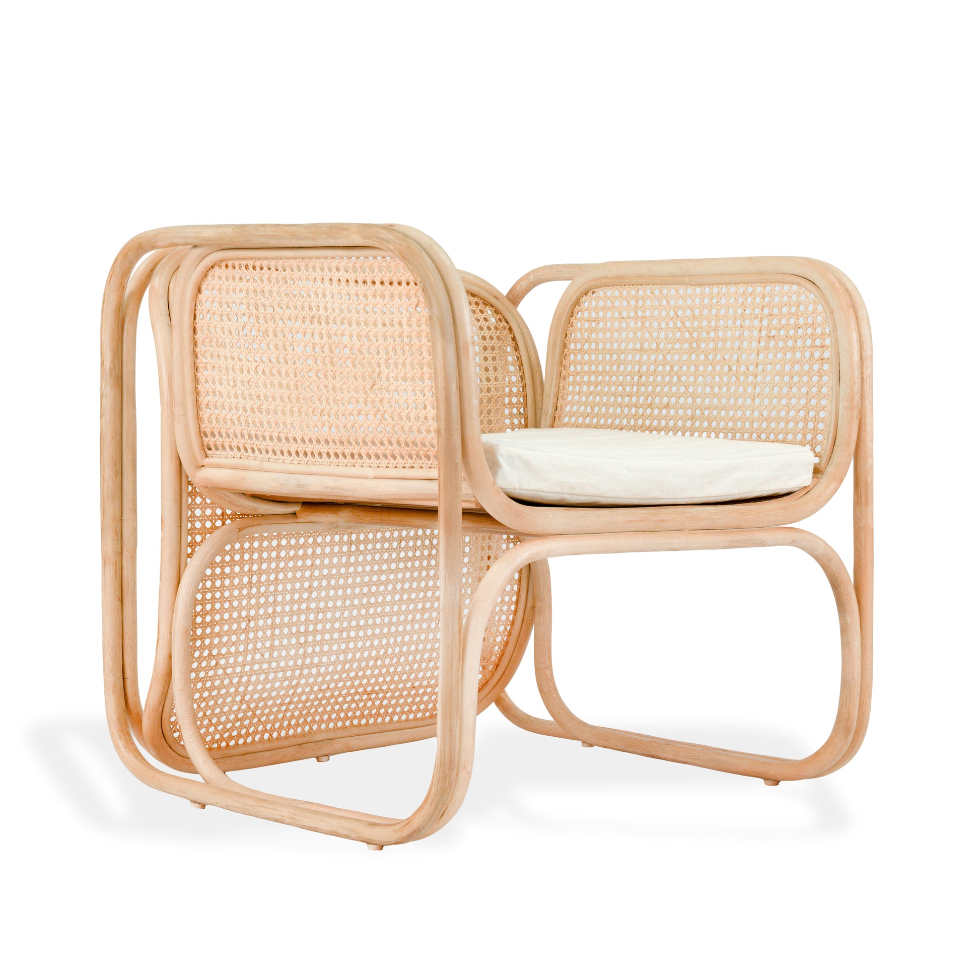 Rattan chair with a white cushion on a white background